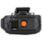 Top side view of the Motorola PMMN4099 IMPRES Windporting Remote Speaker Microphone (RSM). This unit features a volume toggle switch, orange emergency button, a 3.5mm non-threaded audio jack, and is waterproof with an IP68 rating. 